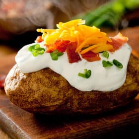 Baked potatoes taste just as good when cooked in the slow cooker! Get this recipe and more at Made in a Pinch. To get recipes and helpful tips follow us on Pinterest!