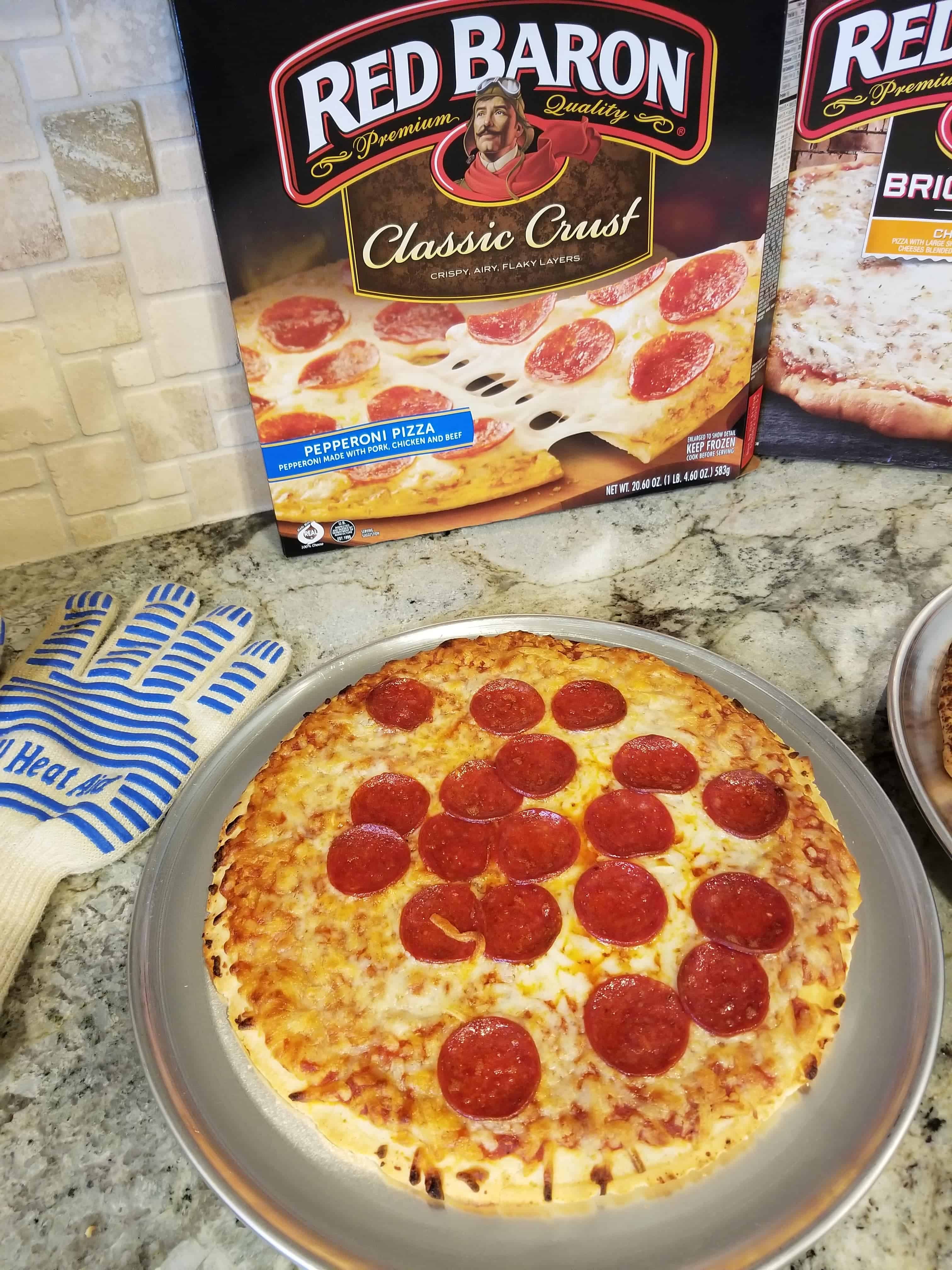 Love that Red Baron pepperoni and so does the whole family! Use this tip and more to reduce summer chaos at Made In a Pinch. Red Baron pizza box with cooked pizza and oven glove.