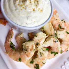 This Garlic Parmesan Shrimp with Roasted Garlic Dip makes an amazing and easy appetizer! Grab the recipe at Made in a Pinch. For more delicious recipes and helpful tips follow us on Pinterest!