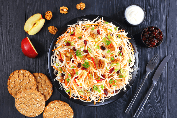Make coleslaw tastier by adding apples and cranberries! Include this festive side dish with your next cookout or potluck.
