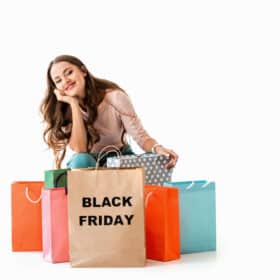 Best Black Friday deals for families: Lady with shopping bags that say Black Friday