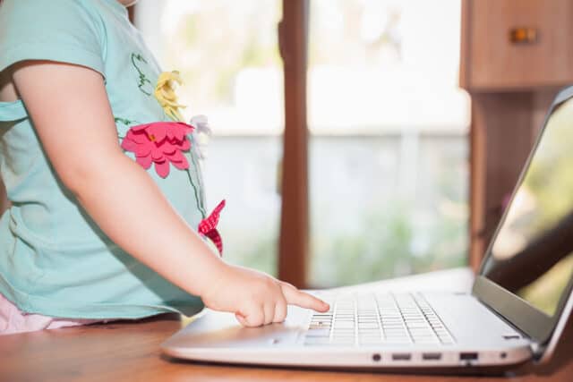 child using a laptop at home