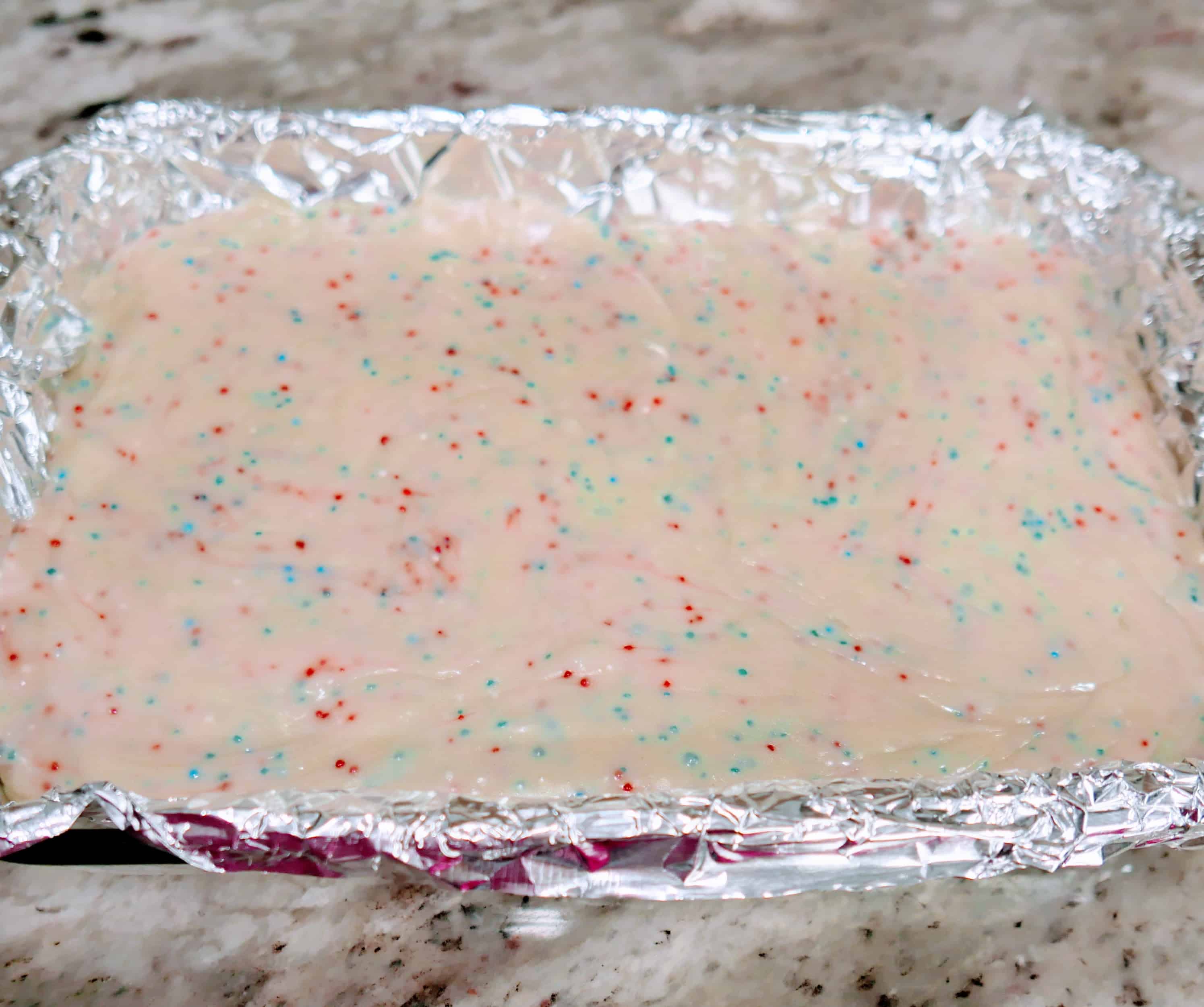 white vanilla fudge recipe mix with sprinkles mixed in