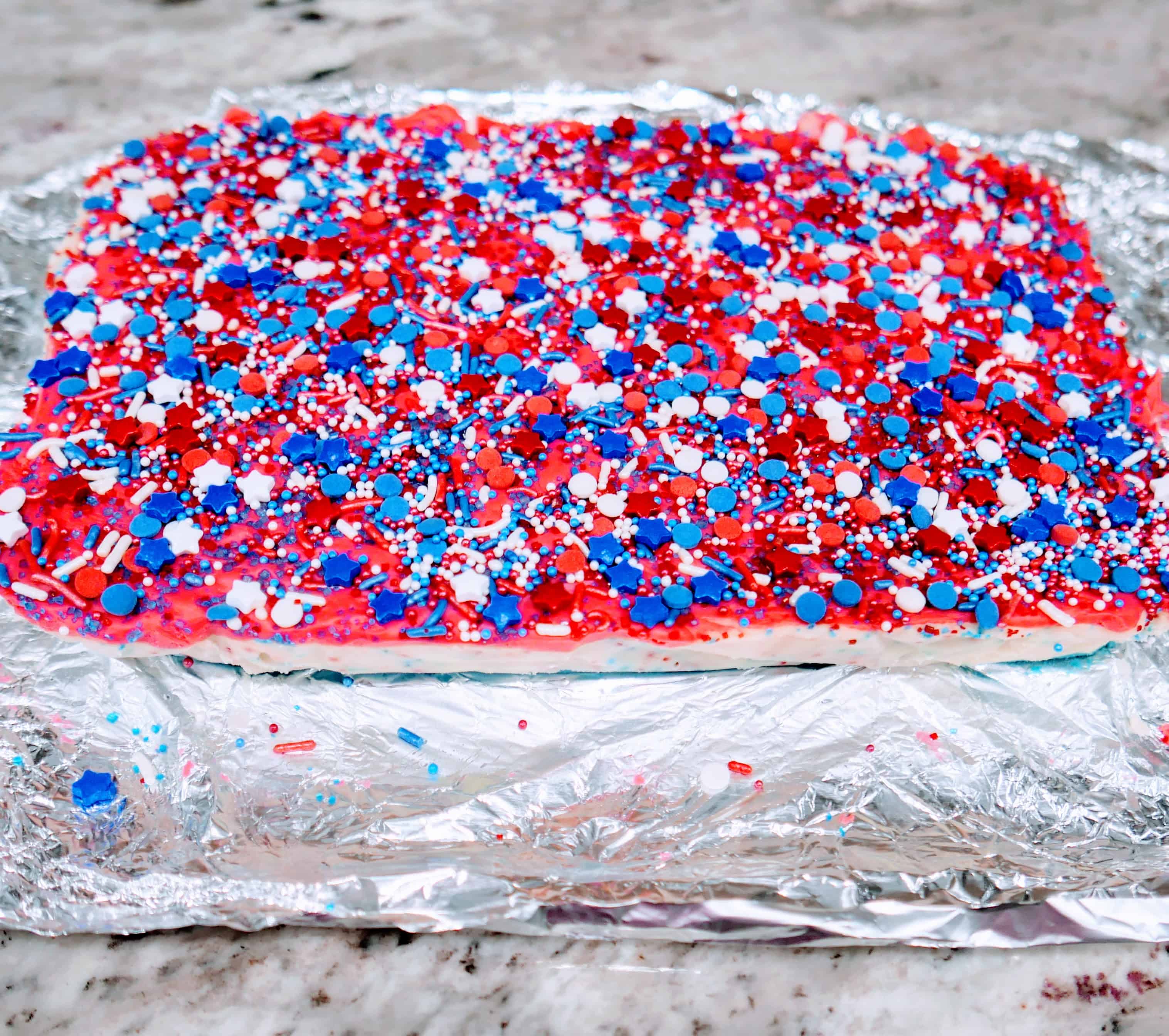 all the layers of fudge put together with sprinkles on top