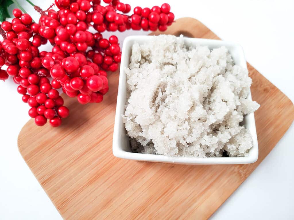 vanilla sugar scrub in a dish with red berries