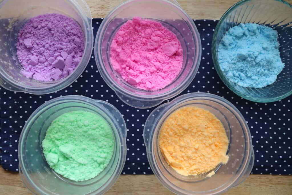 bowls of colored bath bomb mixture