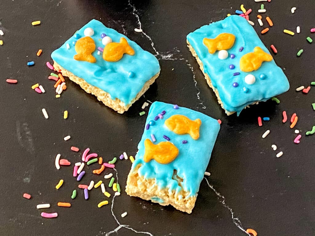 3 decorated 1fish2fish rice krispy treats with scattered sprinkles