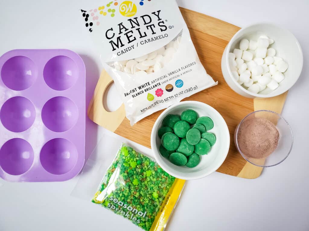 ingredients and supplies for St. Patrick's Day DIY hot cocoa bombs