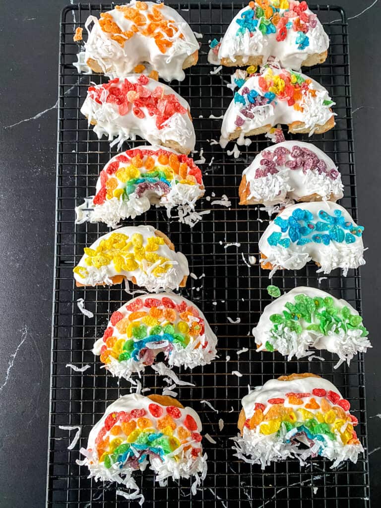 data-pin-description="A deliciously fun and quick activity - and TREAT! These rainbow donuts are insanely quick to make, perfect for any day you want a little sunshine in your life or St. Patrick's Day, and a GREAT way to let kids work on their color sorting skills! Make these rainbow donuts today - just click through to get the recipe 10-minute recipe. #stpatricksday #donuts #rainbowdonuts | Made in A Pinch @madeinapinch"