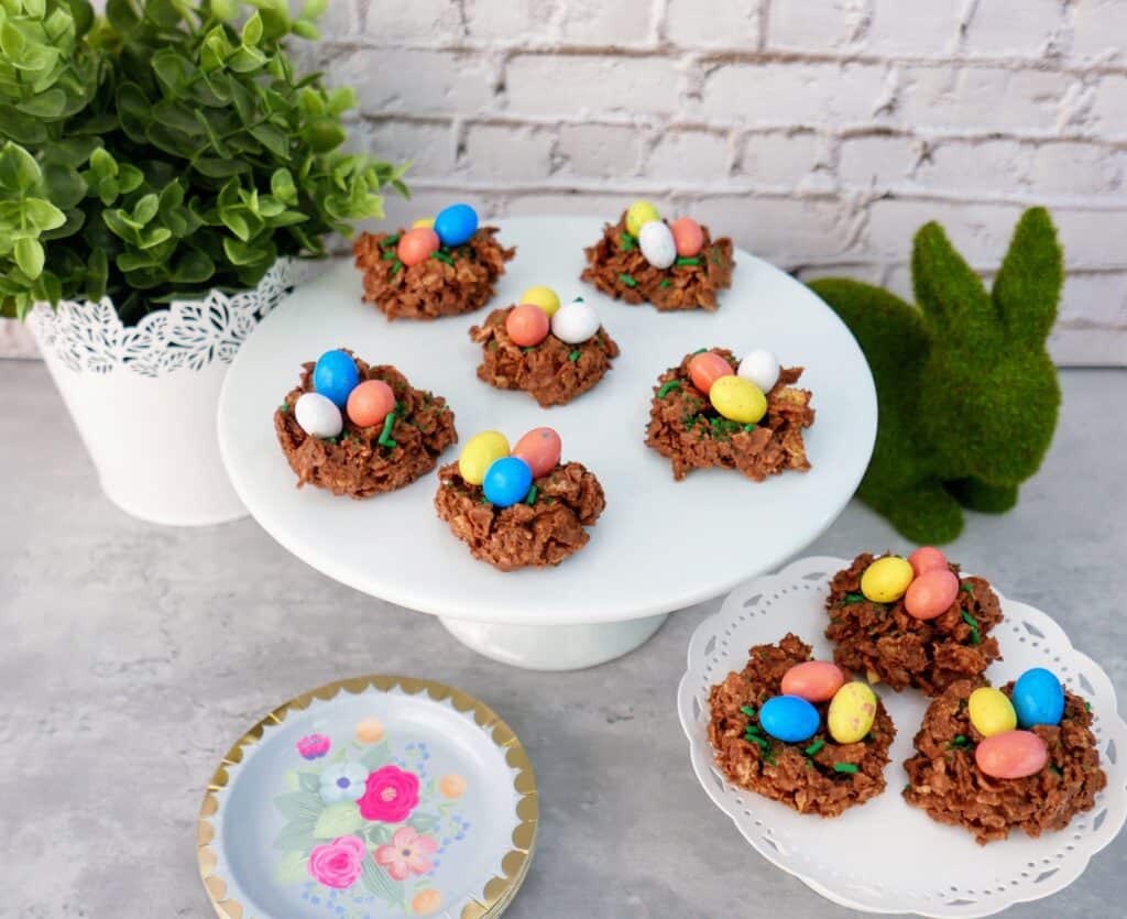 Chocolate and Peanut Butter Bird’s Nest Cookies - a sweet Easter treat that is quick, easy, and FUN to make! These bird's nest treats have a twist from the typical way of making them and are kid-approved and lip-smackin' good!! These Easter Bird's Nest cookies are a traditional Easter recipe with a fun new twist. Plus they're SO CUTE! #Easter #birdsnest #nobake #cookies #dessert #treats 