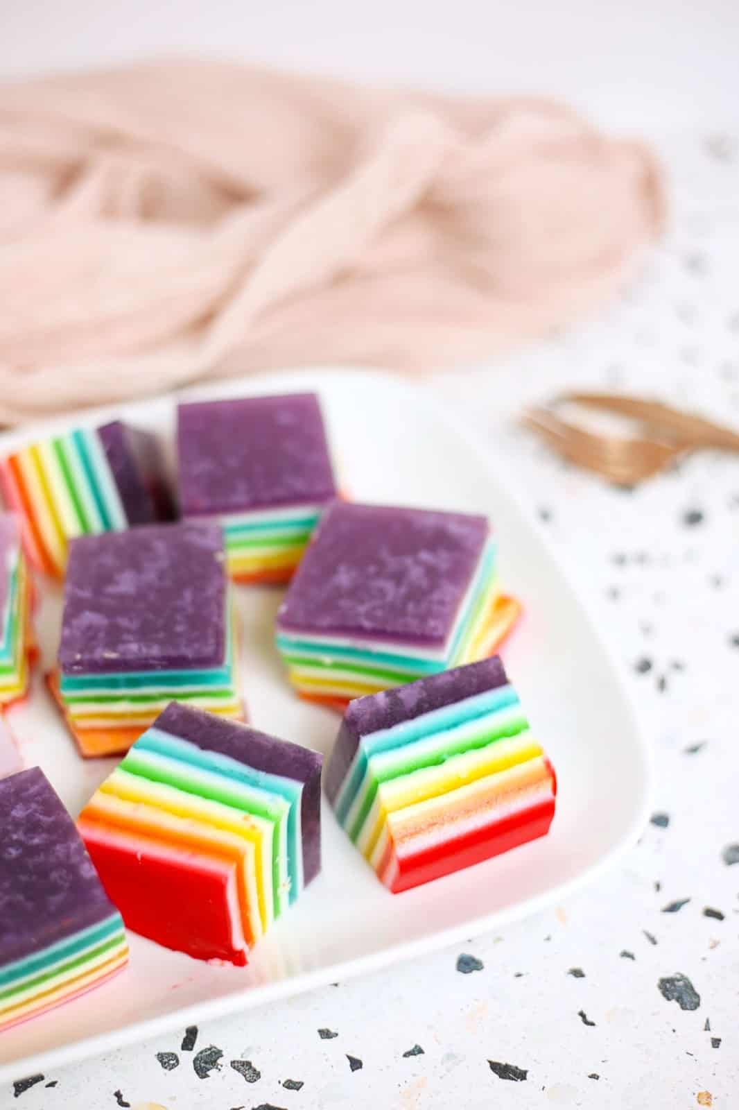 rainbow jello squares on a plate