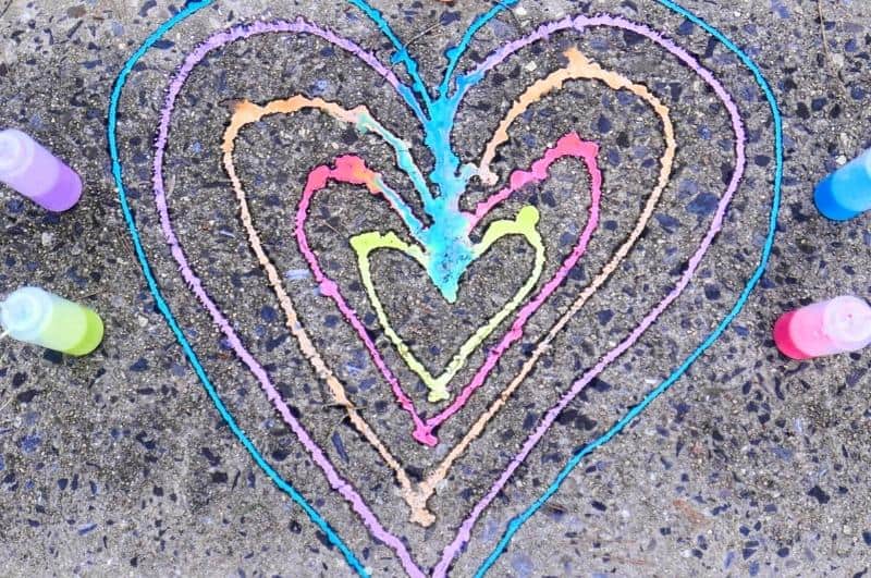 colorful heart on pavement made with sidewalk chalk