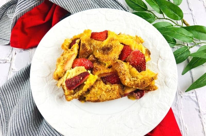 strawberry french toast casserole slice on a plate
