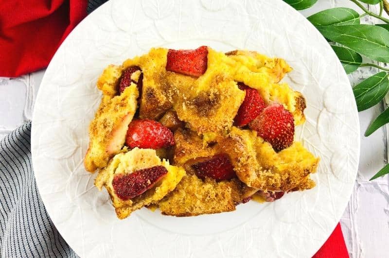 Strawberry french toast bake slice on a plate.