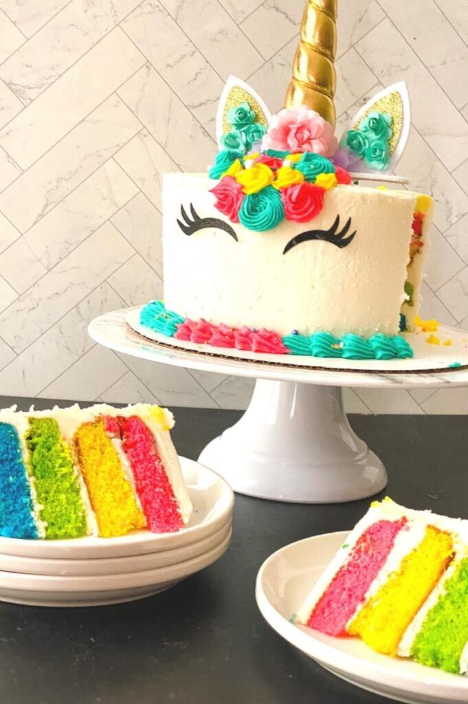 unicorn birthday cake with a cut slice