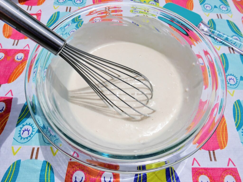stirring puffy paint ingredients with whisk
