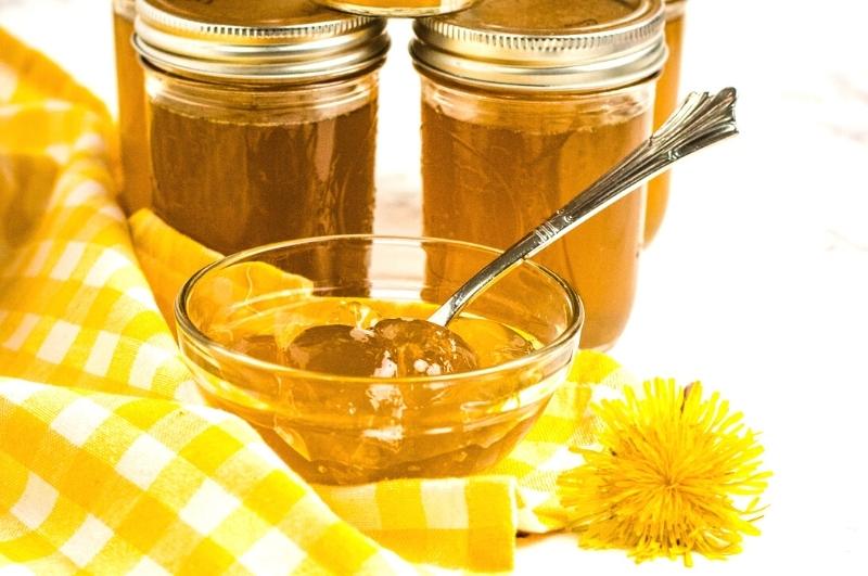 dandelion jelly in jars and a bowl