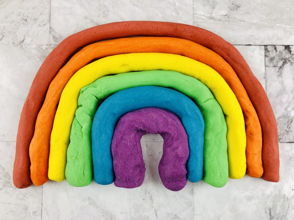rainbow made out of strips of colored homemade playdough