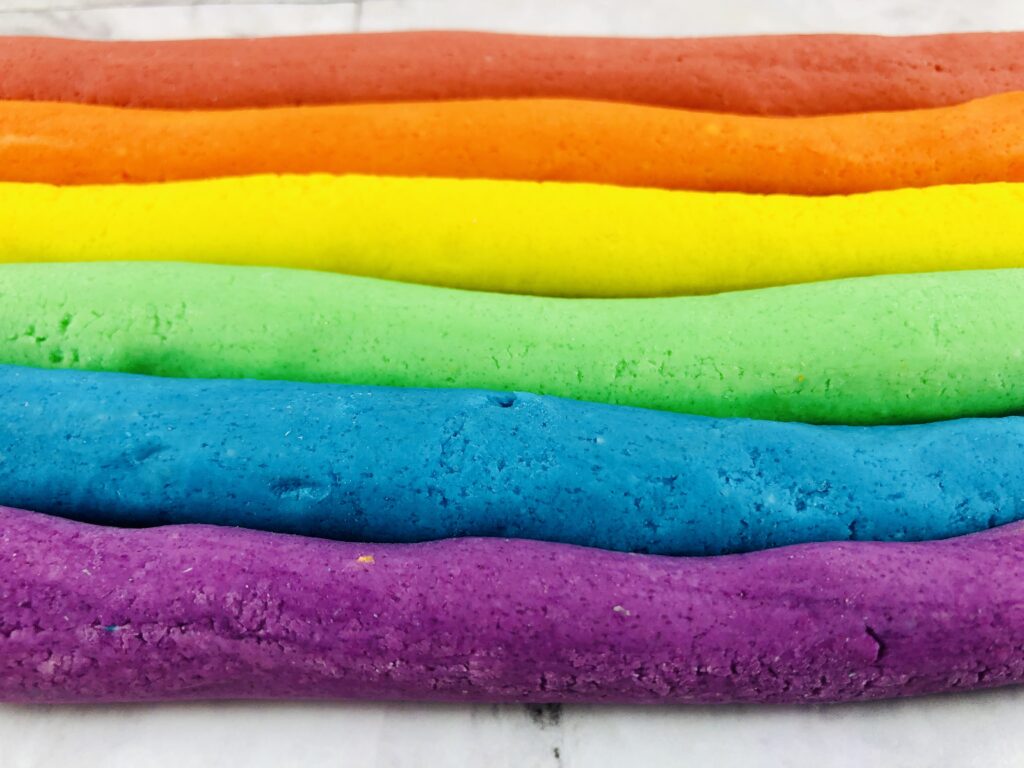 strips of colored homemade rainbow playdough
