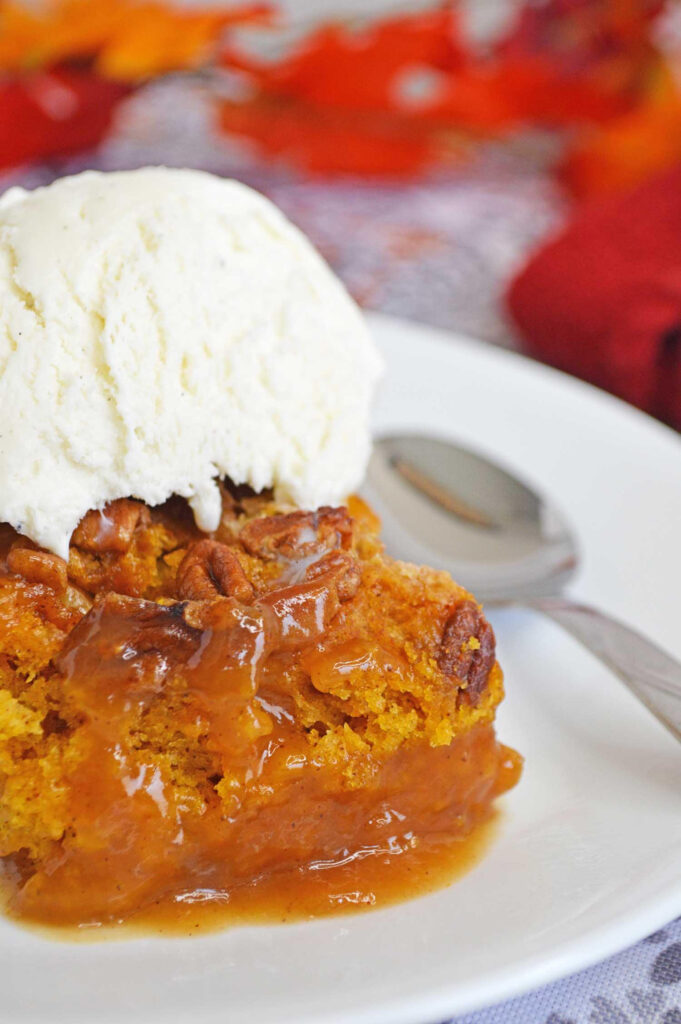 pumpkin upside down cake on a plate with ice cream