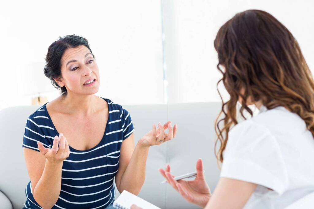 woman talking to therapist for good mental health