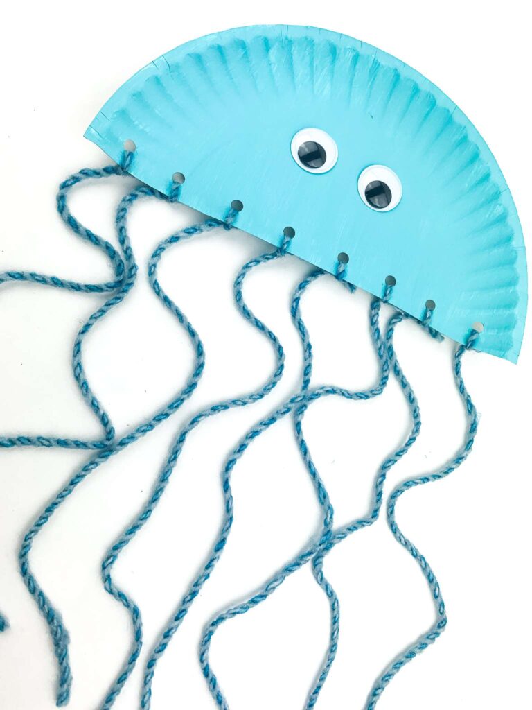 adding google eyes to paper plate jellyfish