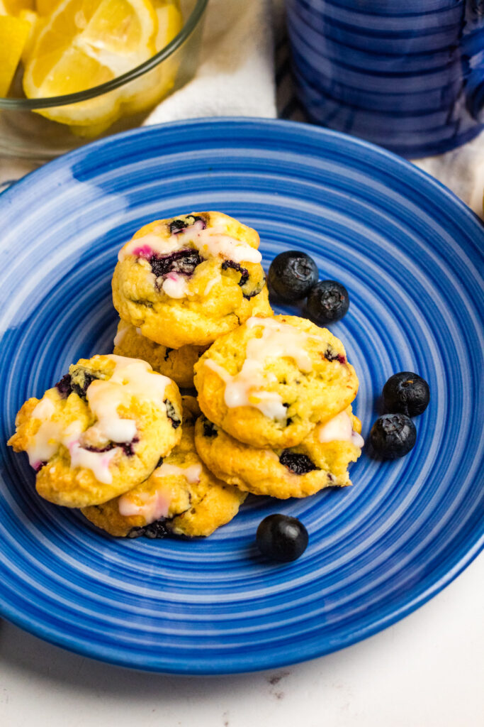 lemon blueberry cookies on blue plate