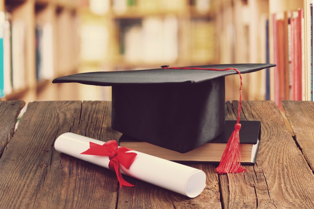 high school graduation cap and diploma