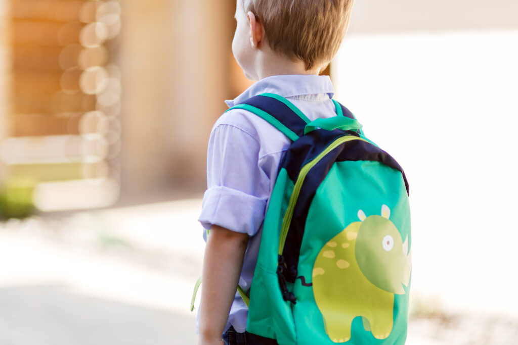 boy wearing backpack for preschool
