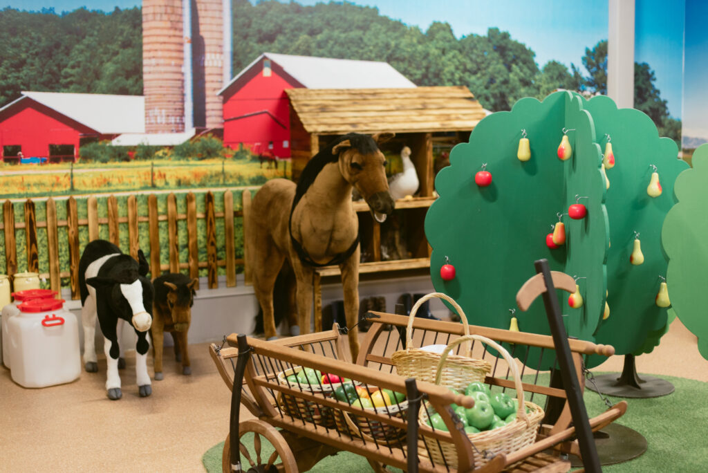 children's toy farm with farm animal toys